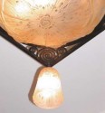 Mueller iron chandelier with peach glass