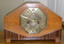 Striking Art Deco Mantle Clock with mixed wood and brass detail
