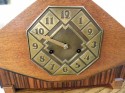 Striking Art Deco Mantle Clock with mixed wood and brass dial