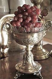 silver chalice and grapes