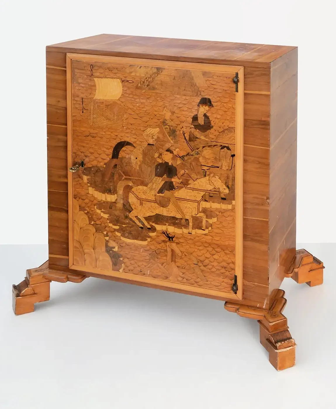 Wooden cabinet with marquetry door depicting horse riders and a dog in a rustic scene.