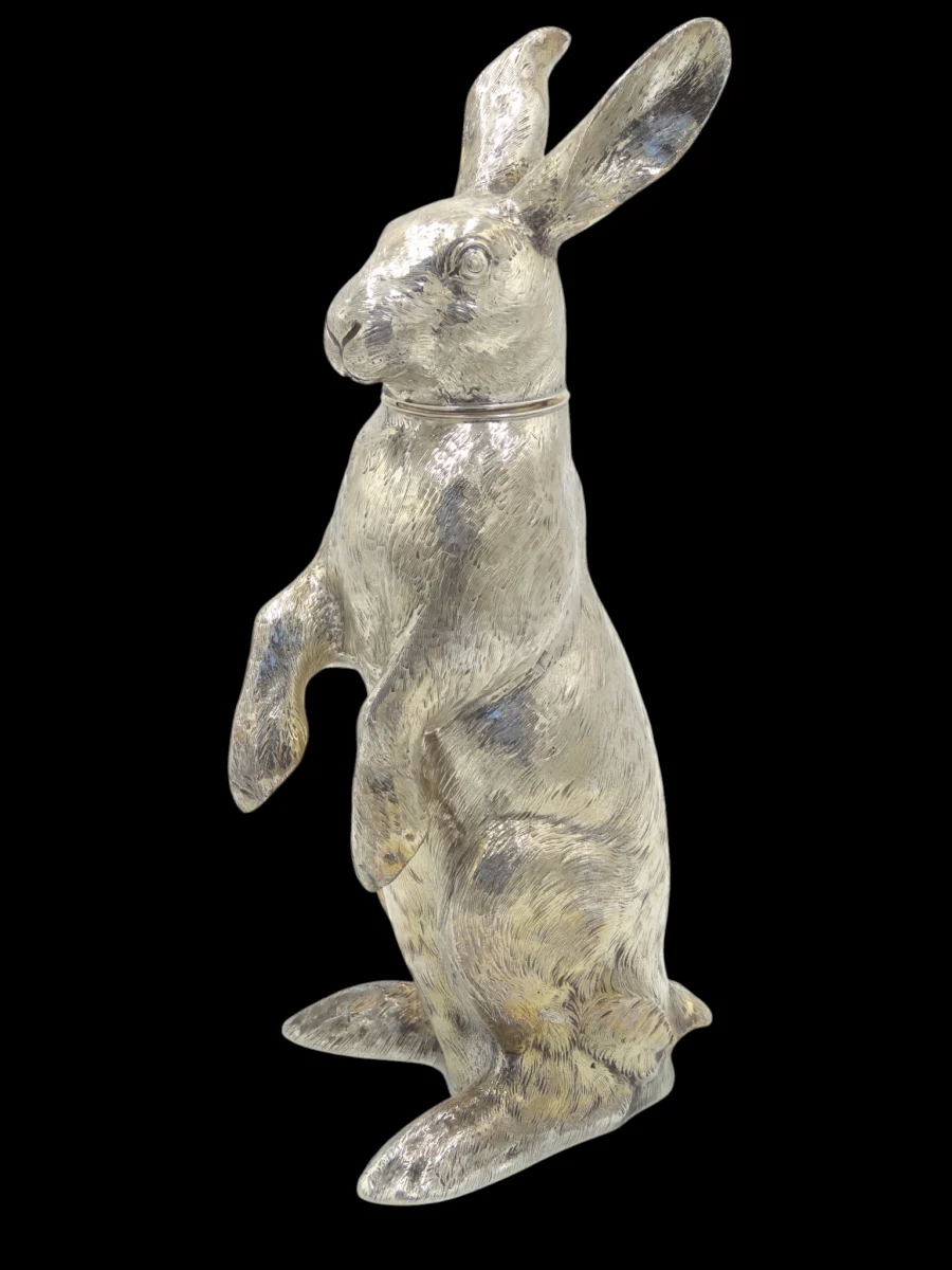 silver rabbit figurine standing upright on hind legs