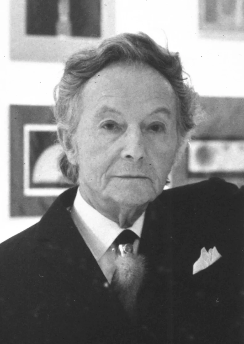black and white portrait of an elderly man in a suit